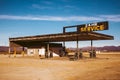 Abandoned gas station with sign reading Ã¢â¬Å24 Hour ServiceÃ¢â¬Â